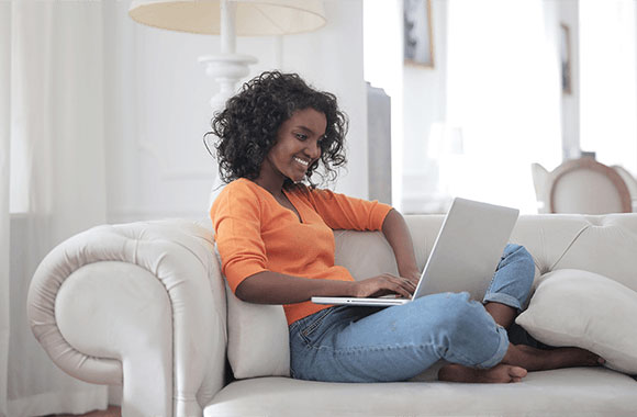 Woman taking virtual Apple training at home during the lockdown - the ideal time to upskill.