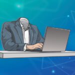 Headless man at desk representing headless CMS advantages for business websites