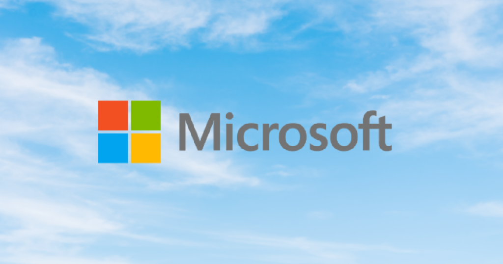 Microsoft logo in front of a blue sky background.