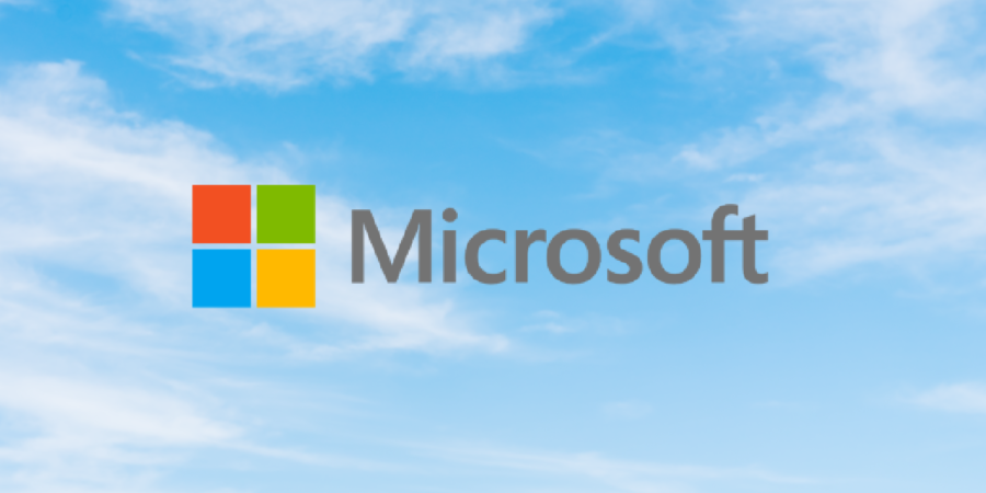 Microsoft logo in front of a blue sky background.